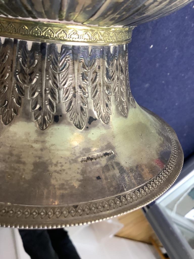 A Persian engraved white metal baluster flagon